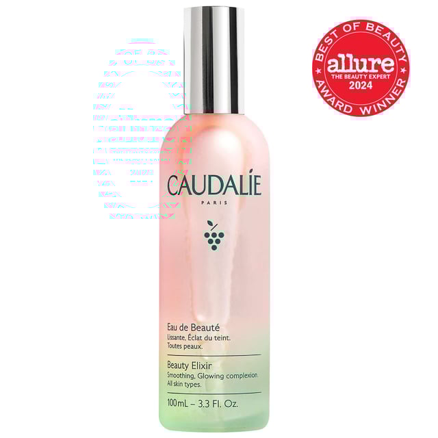 Revitalize your skin with Caudalie's Beauty Elixir, a versatile mist designed to prep and refresh your complexion. This iconic face mist doubles as a makeup setting spray and contains 100% natural ingredients like green grape, orange blossom, and essential oils such as peppermint and rose. Suitable for all skin types, it hydrates, calms, and tightens pores. Use it in your skincare routine or as a quick refresh. Loved by A-listers and makeup artists, this vegan formula is a handbag essential for a radiant glow. Enjoy a cooling sensation by storing it in the fridge.