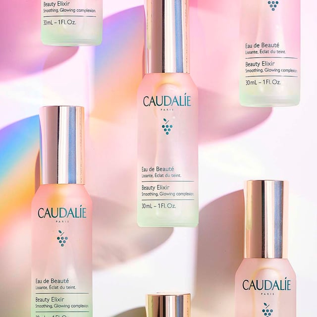 Revitalize your skin with Caudalie's Beauty Elixir, a versatile mist designed to prep and refresh your complexion. This iconic face mist doubles as a makeup setting spray and contains 100% natural ingredients like green grape, orange blossom, and essential oils such as peppermint and rose. Suitable for all skin types, it hydrates, calms, and tightens pores. Use it in your skincare routine or as a quick refresh. Loved by A-listers and makeup artists, this vegan formula is a handbag essential for a radiant glow. Enjoy a cooling sensation by storing it in the fridge.