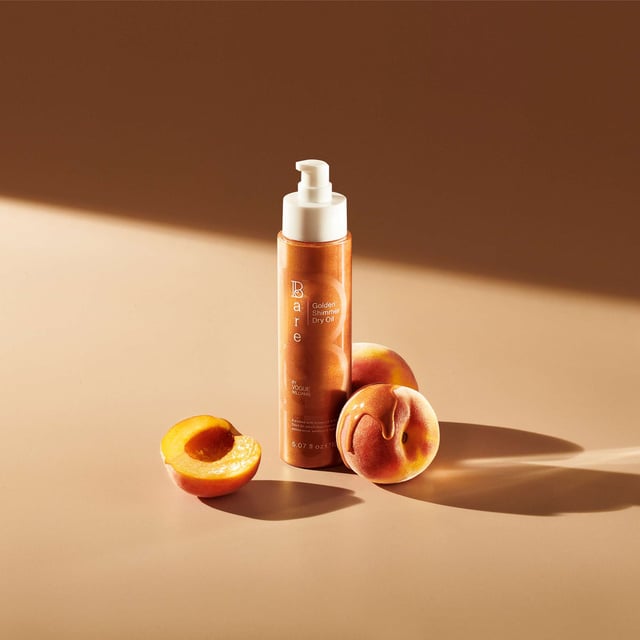 Experience the ultimate luxury with Bare by Vogue's Golden Shimmer Dry Oil, designed to give your skin a radiant and hydrated glow. This exquisite dry oil is infused with a delicate golden shimmer that enhances your skin's natural beauty while replenishing moisture. The heavenly scent transforms your skincare routine, leaving your skin fragrant and beautifully sparkled. Lightweight yet indulgent, this shimmering body oil nourishes dry areas and provides a glowing finish that lasts all day.