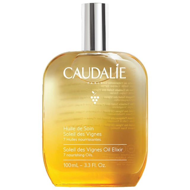 Experience the essence of summer with Caudalie Soleil des Vignes Nourishing Body Oil Elixir. This luxurious body oil features a captivating sun-inspired fragrance that envelops your senses. Infused with a blend of nourishing oils, including Argan, Shea, and cold-pressed grape seed oil, it delivers deep hydration and revitalizes your skin. The enchanting aroma of coconut milk and orange blossom enhances your sensory experience, while the rich yet lightweight formula absorbs quickly without leaving a greasy residue. Ideal for use on body, hair, and décolleté, this versatile elixir ensures a radiant glow for all skin types. Embrace the summer spirit and indulge in this exquisite treatment. Apply generously on dry skin after showering, or use on damp hair for a weekly rejuvenating treatment. Caudalie is committed to sustainability, contributing 1% of its turnover to environmental protection initiatives. Join us in making a difference.