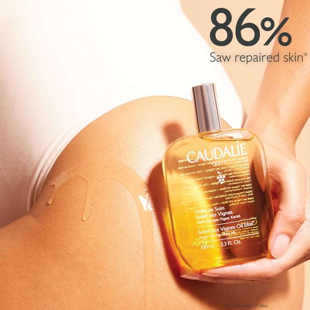 Experience the essence of summer with Caudalie Soleil des Vignes Nourishing Body Oil Elixir. This luxurious body oil features a captivating sun-inspired fragrance that envelops your senses. Infused with a blend of nourishing oils, including Argan, Shea, and cold-pressed grape seed oil, it delivers deep hydration and revitalizes your skin. The enchanting aroma of coconut milk and orange blossom enhances your sensory experience, while the rich yet lightweight formula absorbs quickly without leaving a greasy residue. Ideal for use on body, hair, and décolleté, this versatile elixir ensures a radiant glow for all skin types. Embrace the summer spirit and indulge in this exquisite treatment. Apply generously on dry skin after showering, or use on damp hair for a weekly rejuvenating treatment. Caudalie is committed to sustainability, contributing 1% of its turnover to environmental protection initiatives. Join us in making a difference.