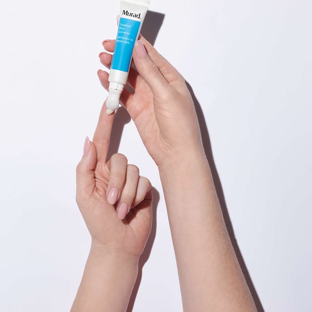 Transform your skin with Murad's Targeted Pore Corrector Serum, a revolutionary bio-tech treatment designed to minimize the appearance of pores with each application. This powerful serum not only reduces pore visibility instantly but also helps decrease pore size over time when used correctly. For best results, cleanse your face with Murad's Clarifying Cleanser, then apply a small amount of the Targeted Pore Corrector directly onto enlarged pores using the applicator tip. Gently dab and let dry before applying your favorite Murad moisturizer and sunscreen for a complete skincare routine.