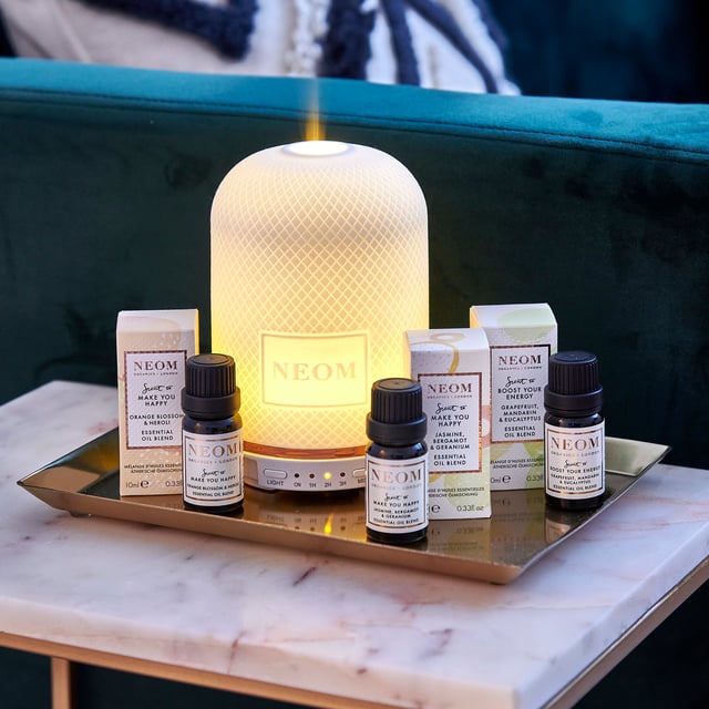 Experience the transformative power of Neom Wellbeing London's Essential Oil Blend, crafted to uplift your spirit and promote happiness. This luxurious blend combines creamy Tuberose, warm Cedarwood, and exotic Ylang Ylang, with hints of Jasmine and Neroli. Perfect for creating a serene atmosphere, this 100% natural fragrance relieves stress, enhances sleep quality, boosts energy, and elevates mood. Use it in your Wellbeing Perfume Pod, in a warm bath, or mix with a base oil for a soothing massage.