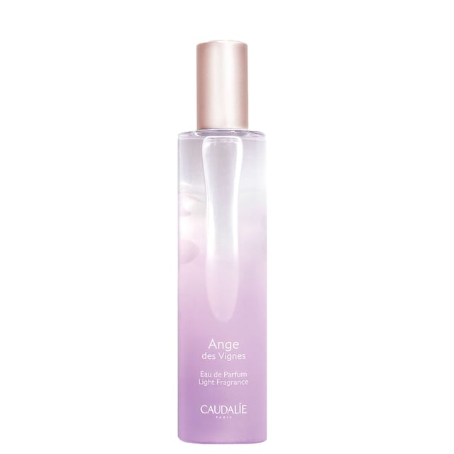 Discover the enchanting Caudalie Ange des Vignes Eau de Parfum Spray, a captivating light fragrance that blends sensual and sparkling notes. This warm chypre scent features delightful hints of raspberry grape, refreshing neroli, and earthy patchouli, creating a unique olfactory experience that evokes the freshness of the sky and vineyards. Key benefits include 89% natural origin ingredients and no artificial colorings. Caudalie has committed to environmental sustainability, contributing 1% of its turnover to protect our planet.