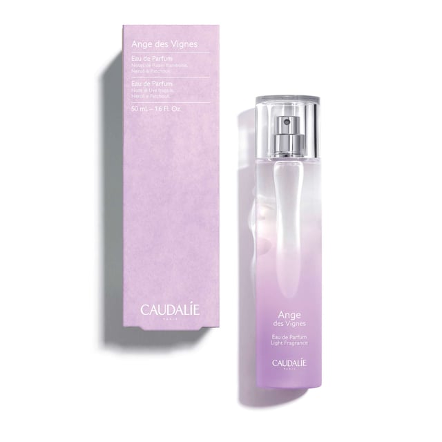 Discover the enchanting Caudalie Ange des Vignes Eau de Parfum Spray, a captivating light fragrance that blends sensual and sparkling notes. This warm chypre scent features delightful hints of raspberry grape, refreshing neroli, and earthy patchouli, creating a unique olfactory experience that evokes the freshness of the sky and vineyards. Key benefits include 89% natural origin ingredients and no artificial colorings. Caudalie has committed to environmental sustainability, contributing 1% of its turnover to protect our planet.