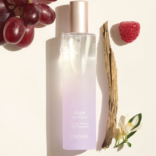 Discover the enchanting Caudalie Ange des Vignes Eau de Parfum Spray, a captivating light fragrance that blends sensual and sparkling notes. This warm chypre scent features delightful hints of raspberry grape, refreshing neroli, and earthy patchouli, creating a unique olfactory experience that evokes the freshness of the sky and vineyards. Key benefits include 89% natural origin ingredients and no artificial colorings. Caudalie has committed to environmental sustainability, contributing 1% of its turnover to protect our planet.