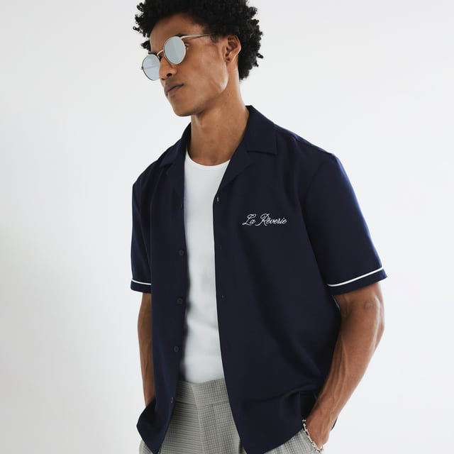 Regular fit, Collared, Small notch lapels, Embroidered back and front graphic, Buttoned fastening, Short sleevesAbout the brandFASHION IS OUR DNARiver Island is an icon of the British high street. Inspired by the latest trends and our heritage style archives, we've been serving style and leading trends for over sixty years.We make fashion for real people with real lives, who want to look real good. Because life's a celebration - let's dress for it.