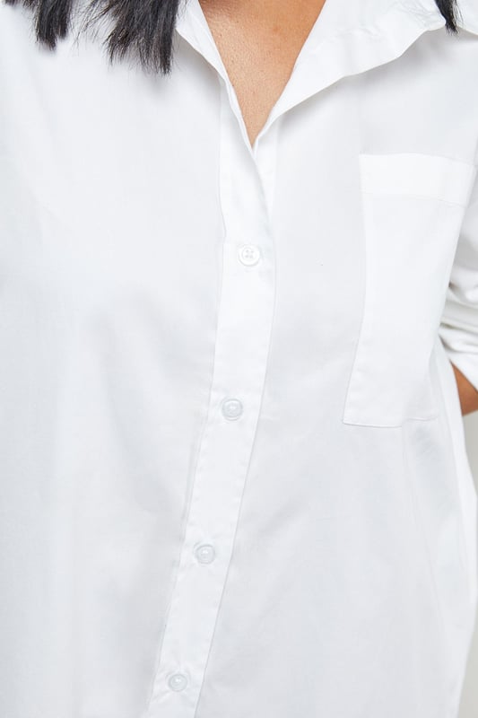 Oversized fit with dramatic side splits for effortless movement
        Midi length design with classic collar and full button-through front
        Long sleeves with buttoned cuffs for versatile styling options
        Relaxed dropped shoulders creating a contemporary silhouette
        Chest pocket detail adding subtle functional interest
    
    Make a statement with this Warehouse oversized midi shirt dress, the epitome of casual sophistication. The generous proportions and side splits create a flowing silhouette that moves beautifully with you, whilst the classic shirt detailing keeps the look grounded in timeless style. Perfect for family gatherings when paired with metallic flats as shown, or dress it down further with white trainers and a crossbody bag for weekend brunches. For cooler days, layer over slim-fit trousers and add a chunky knit cardigan. The cotton-rich fabric offers comfort for all-day wear, making this an ideal choice for those busy days when you need to look put-together with minimal effort. This versatile piece transitions effortlessly from casual daytime events to relaxed evening occasions - simply switch your accessories to refresh your look.