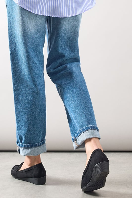 Faux suede moccasin loafers with decorative trim detail for a classic finish
        Subtle wedge heel (under 2cm) provides gentle lift without sacrificing comfort
        Cushioned footbed designed specifically for all-day wear
        Slip-on style with moccasin stitching for effortless everyday dressing
        Part of our Good For The Sole collection, crafted with comfort in mind
    
    These Viridiana moccasin loafers blend timeless style with exceptional comfort, making them a wardrobe essential for the modern woman. The subtle wedge provides just enough height to flatter without compromising on wearability, whilst the faux suede texture adds a touch of sophistication to casual ensembles. Style them with rolled-up jeans for a relaxed weekend look, or pair with tailored trousers and a crisp shirt for smart-casual office days. The versatile design works beautifully with everything from floaty midi dresses to cropped trousers, making these loafers perfect for family gatherings, casual brunches, or those busy days when you're on your feet. The thoughtful comfort features ensure these will quickly become your go-to footwear choice when you need both style and practicality.