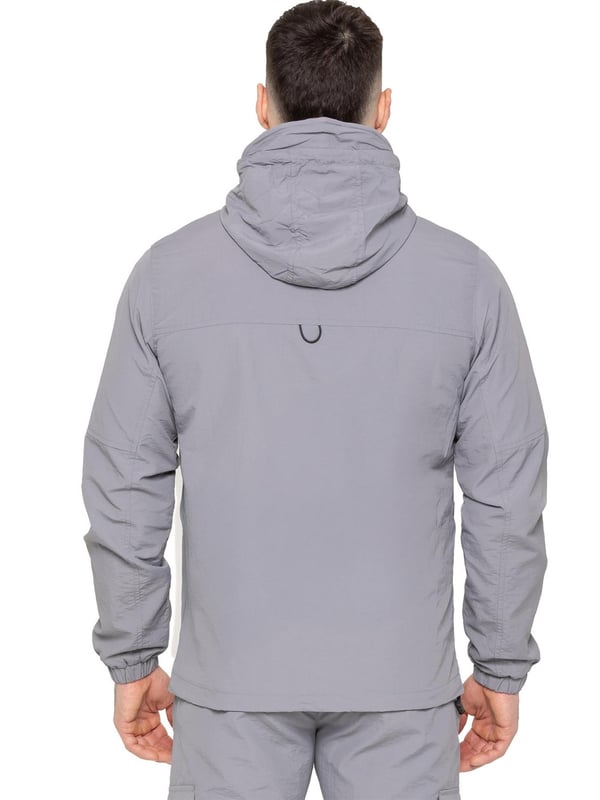 Gear up with the Enzo Milano Men’s Lightweight Cargo Jacket & Pants Set, built for comfort, function, and style. The jacket features water-repellent crushed poly fabric with a breathable mesh lining, full zip front, adjustable hood, and multiple secure pockets. Paired with lightweight cargo pants in a regular fit, this set includes an elasticated waistband with drawstring, cargo pockets, and adjustable hems for a personalized fit.