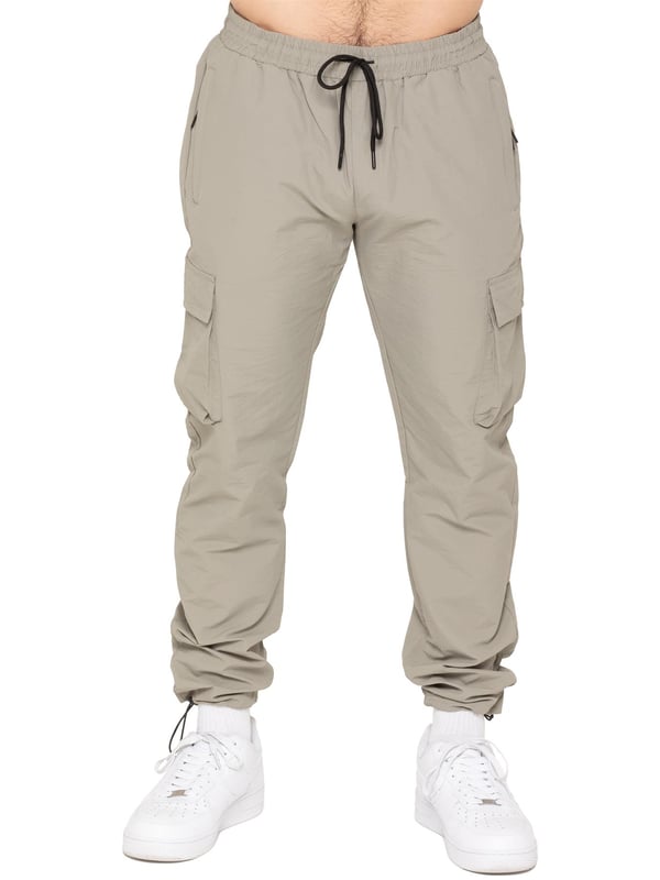 Gear up with the Enzo Milano Men’s Lightweight Cargo Jacket & Pants Set, built for comfort, function, and style. The jacket features water-repellent crushed poly fabric with a breathable mesh lining, full zip front, adjustable hood, and multiple secure pockets. Paired with lightweight cargo pants in a regular fit, this set includes an elasticated waistband with drawstring, cargo pockets, and adjustable hems for a personalized fit.
