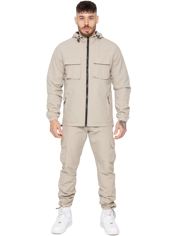 Gear up with the Enzo Milano Men’s Lightweight Cargo Jacket & Pants Set, built for comfort, function, and style. The jacket features water-repellent crushed poly fabric with a breathable mesh lining, full zip front, adjustable hood, and multiple secure pockets. Paired with lightweight cargo pants in a regular fit, this set includes an elasticated waistband with drawstring, cargo pockets, and adjustable hems for a personalized fit.