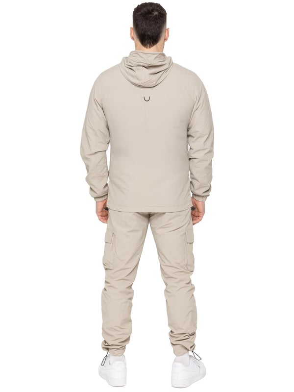 Gear up with the Enzo Milano Men’s Lightweight Cargo Jacket & Pants Set, built for comfort, function, and style. The jacket features water-repellent crushed poly fabric with a breathable mesh lining, full zip front, adjustable hood, and multiple secure pockets. Paired with lightweight cargo pants in a regular fit, this set includes an elasticated waistband with drawstring, cargo pockets, and adjustable hems for a personalized fit.