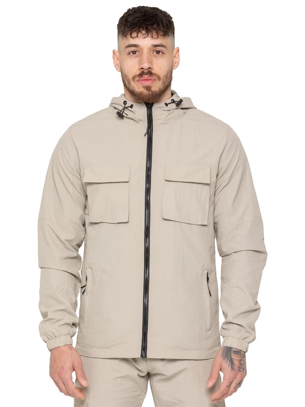 Gear up with the Enzo Milano Men’s Lightweight Cargo Jacket & Pants Set, built for comfort, function, and style. The jacket features water-repellent crushed poly fabric with a breathable mesh lining, full zip front, adjustable hood, and multiple secure pockets. Paired with lightweight cargo pants in a regular fit, this set includes an elasticated waistband with drawstring, cargo pockets, and adjustable hems for a personalized fit.