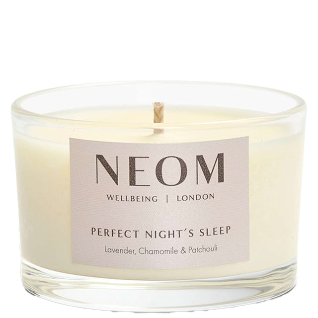 Neom Wellbeing London Scent to Sleep Candle - Perfect Night's Sleep Travel Size 75g Experience the calming power of Neom Wellbeing London’s Scent to Sleep Candle, designed to promote restful sleep. This travel-sized candle features a blend of 19 pure essential oils, including lavender, chamomile, and patchouli. Hand-poured with natural vegetable wax, it transforms your space into a tranquil retreat. Ideal for small rooms or on-the-go relaxation, it offers up to 20 hours of burn time. Light this candle for a minimum of 2 hours to enjoy its soothing benefits. Neom is a Certified B Corporation, committed to high social and environmental standards.