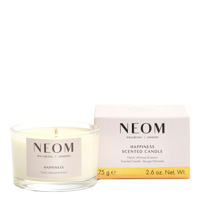 Neom Happiness Scented Candle - Travel Size 75g for Uplifting Wellbeing Experience the uplifting power of Neom's Happiness Scented Candle, crafted to enhance your wellbeing. This 75g candle features a joyful blend of white neroli, mimosa, and lemon, creating an inviting aroma. With 100% natural fragrances, Neom candles help relieve stress and elevate your mood. Hand-poured with pure vegetable wax, each candle burns for up to 20 hours, perfect for smaller spaces or travel. Embrace moments of happiness and transform your environment into a tranquil haven. Neom is a Certified B Corporation, committed to ethical practices.