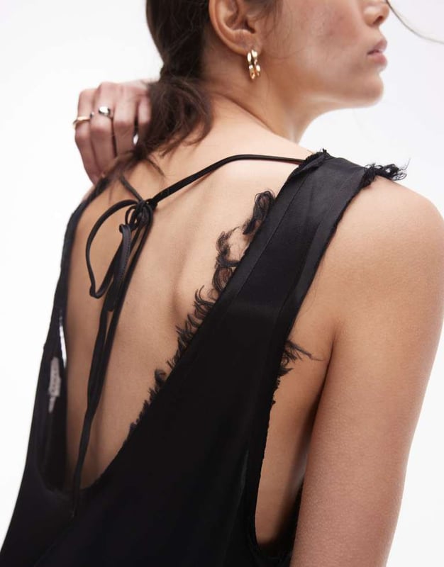 Dresses by Topshop This is Topshop Scoop neck Sleeveless style Tie-back fastening Relaxed fitSold By: Asos