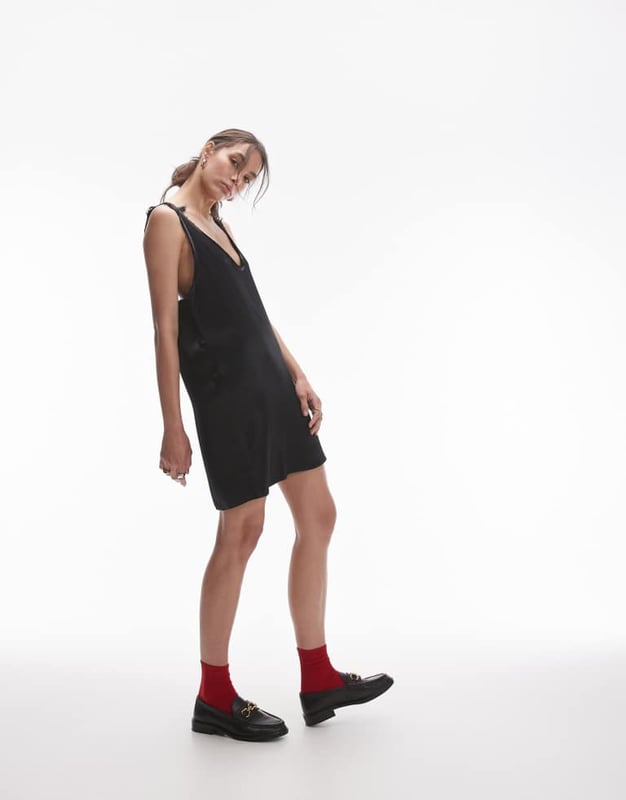 Dresses by Topshop This is Topshop Scoop neck Sleeveless style Tie-back fastening Relaxed fitSold By: Asos
