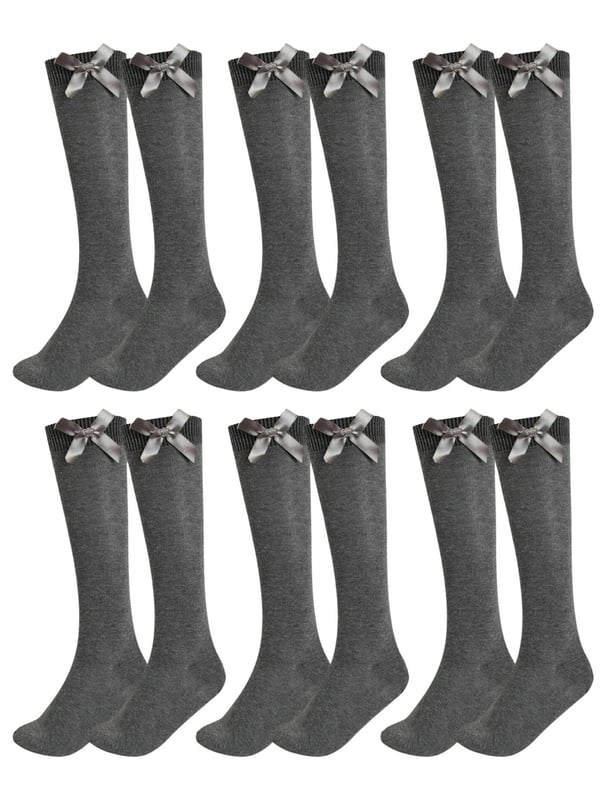 Add a touch of elegance to everyday wear with these charming knee-high socks, perfect for both ladies and girls. Made from a cotton-rich blend with Lycra, they offer exceptional softness, breathability, and a comfortable stretch that hugs the legs without slipping down. Featuring a delicate satin bow at the top, these socks bring a stylish and feminine flair—ideal for school, special occasions, or simply dressing up an outfit