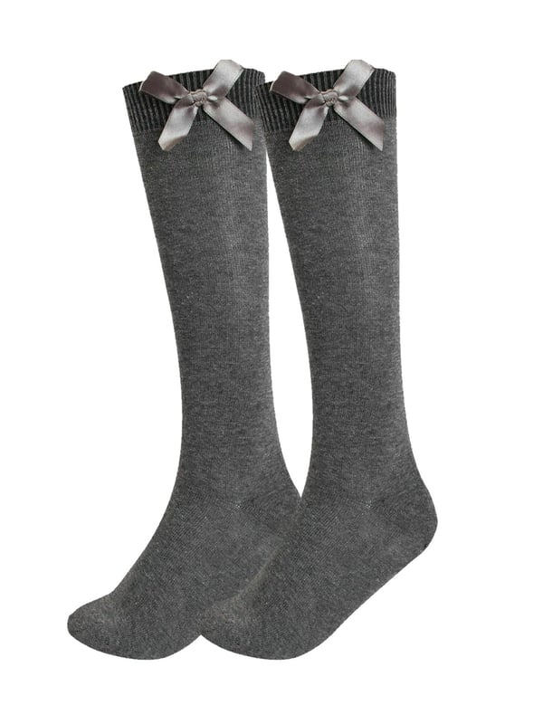 Add a touch of elegance to everyday wear with these charming knee-high socks, perfect for both ladies and girls. Made from a cotton-rich blend with Lycra, they offer exceptional softness, breathability, and a comfortable stretch that hugs the legs without slipping down. Featuring a delicate satin bow at the top, these socks bring a stylish and feminine flair—ideal for school, special occasions, or simply dressing up an outfit