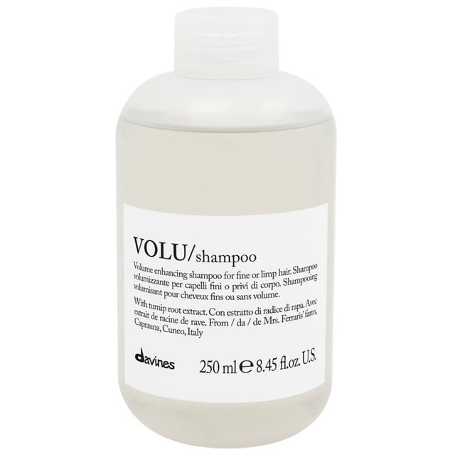 Experience the transformative power of Davines VOLU Shampoo, specially formulated for fine or limp hair. This volumizing shampoo gently cleanses while providing a soft, lightweight feel and a long-lasting boost of body and volume. Key benefits include immediate volume enhancement, a light and foamy texture, and naturally shiny hair. Committed to sustainability, this product is crafted with 100% clean energy and packaged in essential, recyclable materials. For best results, apply to wet hair, massage gently, rinse thoroughly, and follow with VOLU mist for enhanced volume.