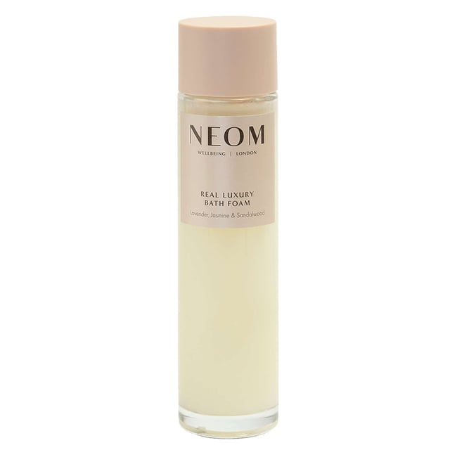 Discover the calming benefits of Neom Wellbeing London's Real Luxury De-Stress Bath Foam. Made with 100% natural essential oils like lavender and jasmine, this bath foam helps you relax and unwind. Enriched with marshmallow, aloe, and sweet almond, it leaves your skin soft and rejuvenated. Pour a capful into warm water for a soothing soak. Neom is dedicated to ethical practices, using 70% certified organic ingredients. Enhance your relaxation with a Neom Scented Candle. Elevate your wellbeing routine with Neom's luxurious bath foam.
