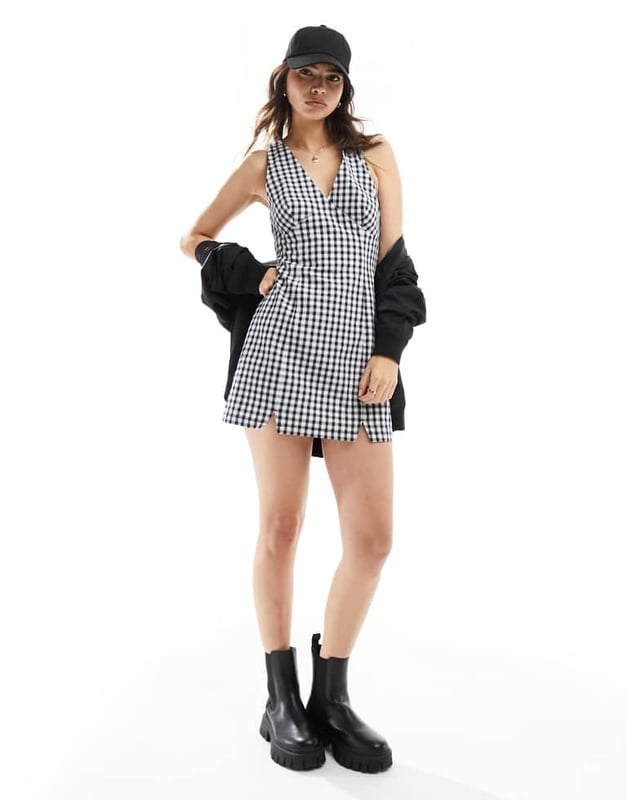 Dresses by Tommy Jeans Check you out V-neck Cross-back straps Slim fitSold By: Asos