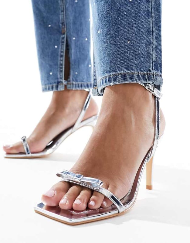 Shoes by Glamorous Give your feet some airtime Adjustable strap Pin-buckle fastening Bow detail Open toe Stiletto heelSold By: Asos