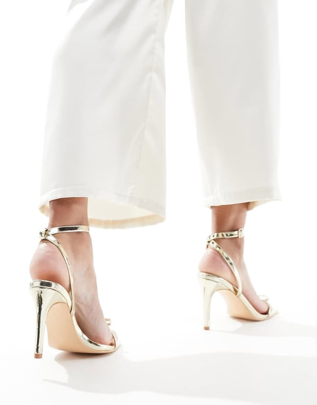 Shoes by Glamorous Give your feet some airtime Adjustable strap Pin-buckle fastening Bow detail Open toe Stiletto heelSold By: Asos