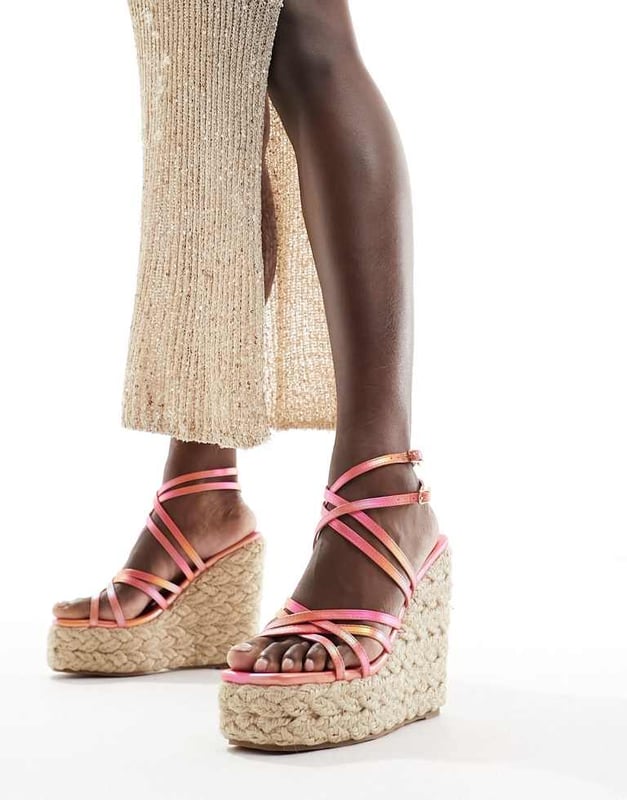 Shoes by Simmi Wide Fit Step into summer Strappy design Adjustable straps Pin-buckle fastening Open toe Rope midsole High wedge heelSold By: Asos