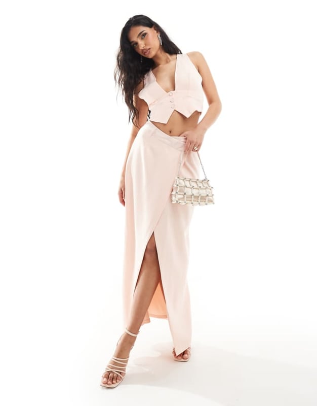 Skirts by Kaiia Part of a co-ord set Top sold separately High rise Belt loops Wrap front Thigh-high split Regular fitSold By: Asos