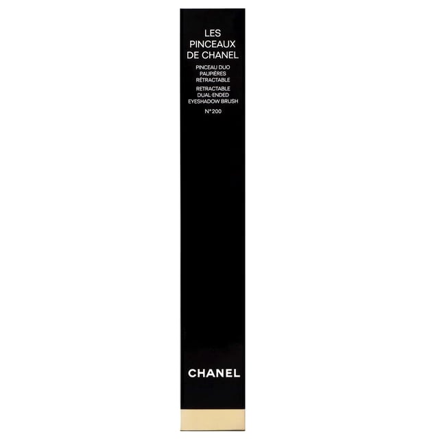 Discover the Chanel N°200 Dual-Ended Eyeshadow Brush, your essential tool for achieving stunning eye looks effortlessly. This luxurious brush features two expertly designed tips for precision application of both cream and powder eyeshadows. Crafted with soft, resilient synthetic bristles, it ensures a smooth, professional finish every time. Housed in a sleek black lacquered case, this brush is perfect for those on-the-go moments. Elevate your makeup routine with this must-have accessory that promises easy blending and an elegant touch to your beauty collection.