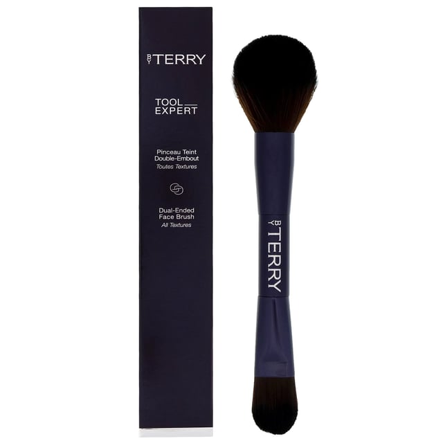 Discover the By Terry Tool-Expert Dual-Ended Makeup Brush, designed by renowned makeup artist Terry de Gunzburg. With over 30 years of experience, Terry has revolutionized the beauty industry since founding By Terry in 1998. This luxurious brush features a flat side for applying liquid and cream foundations effortlessly, while the domed side is perfect for pressed and loose powders. Achieve a professional-quality finish with every use, as this brush ensures even product distribution for a smooth look. Elevate your makeup routine with this essential tool that combines convenience and efficacy.