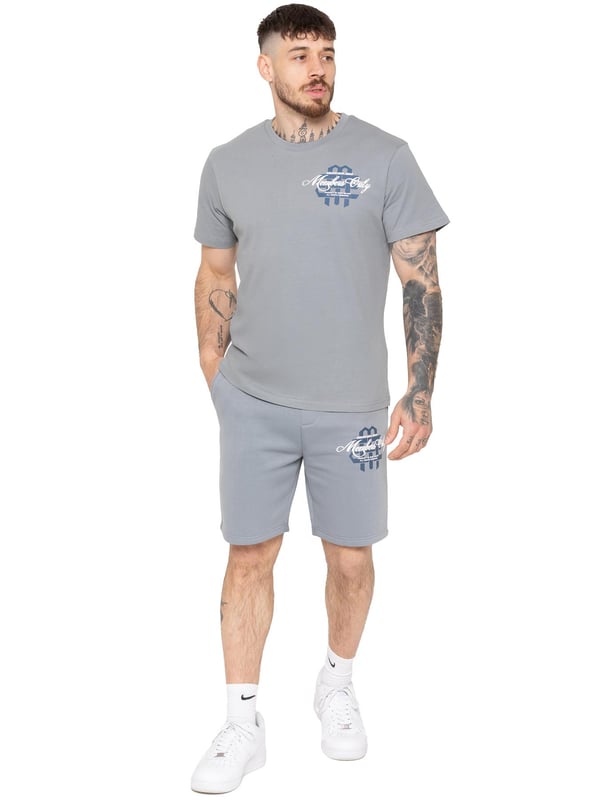 Step up your casual style with the Enzo Milano Men's Printed T-Shirt & Shorts Set. The regular-fit tee features bold "Members Only" puff prints on the front and back, with a ribbed crew neck for comfort and style. The matching fleece-lined shorts offer a relaxed fit, adjustable drawstring waist, and side pockets, finished with a striking puff print on the leg. Perfect for everyday wear with a modern streetwear edge.
