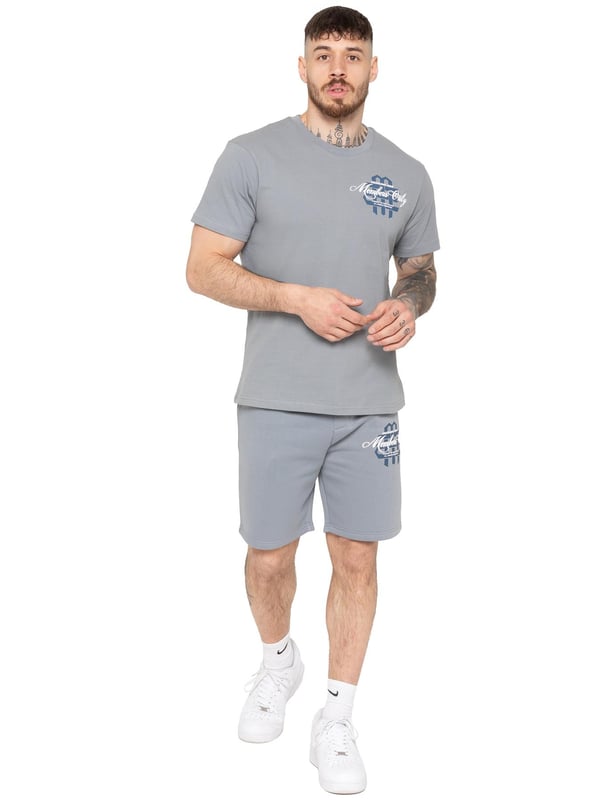 Step up your casual style with the Enzo Milano Men's Printed T-Shirt & Shorts Set. The regular-fit tee features bold "Members Only" puff prints on the front and back, with a ribbed crew neck for comfort and style. The matching fleece-lined shorts offer a relaxed fit, adjustable drawstring waist, and side pockets, finished with a striking puff print on the leg. Perfect for everyday wear with a modern streetwear edge.