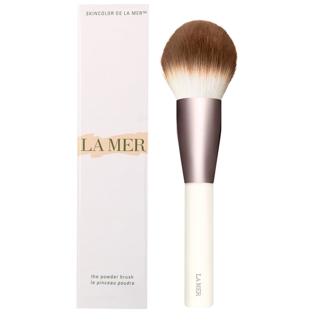 Discover the ultimate makeup application with the LA MER Powder Brush. Designed with a dense head and thousands of ultra-soft bristles, this brush delivers customizable coverage, allowing you to achieve anything from sheer to full coverage with your favorite powder makeup. Crafted with high-quality synthetic bristles, it ensures a hygienic and easy-to-maintain tool for your beauty routine. Elevate your makeup game with this essential accessory that combines luxury and functionality.