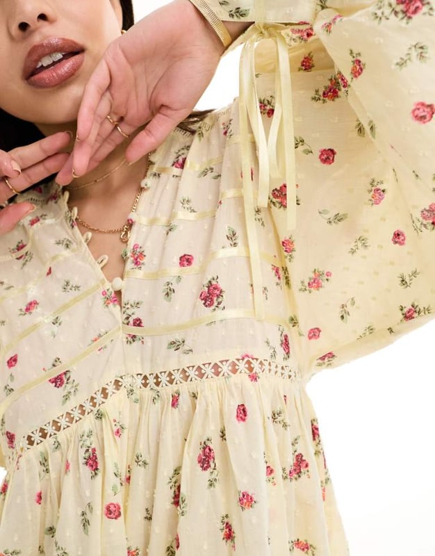 Jumpsuits & Playsuits by ASOS DESIGN Floral design V-neck Button placket Blouson sleeves Lace inserts Regular fitSold By: Asos