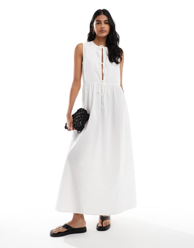 Dresses by ASOS DESIGN The one that goes with everything Crew neck Tie front Sleeveless style Regular fitSold By: Asos