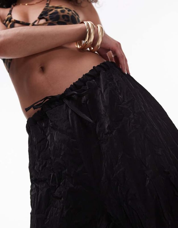 Trousers & Leggings by Topshop This is Topshop Crinkle finish High rise Drawstring waistband Relaxed fitSold By: Asos