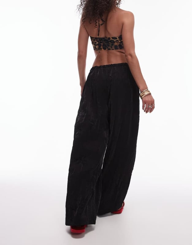 Trousers & Leggings by Topshop This is Topshop Crinkle finish High rise Drawstring waistband Relaxed fitSold By: Asos