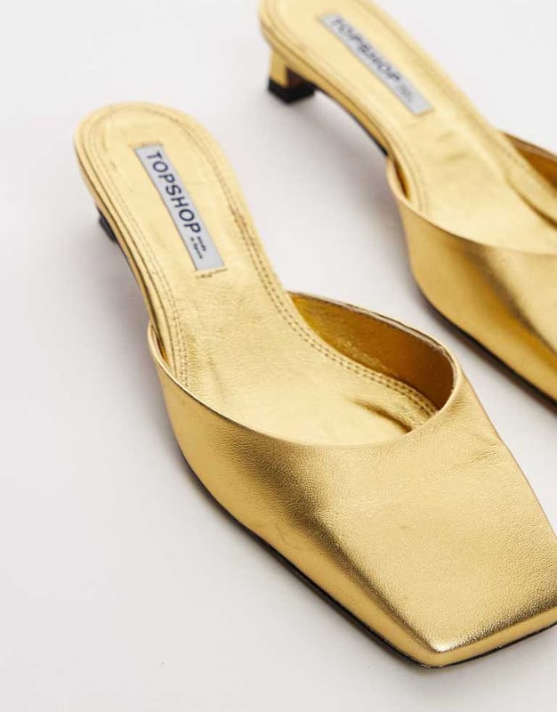 Shoes by Topshop This is Topshop Metallic finish Slip-on style Square toe Flat sole Low block heelSold By: Asos