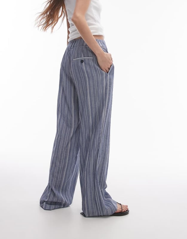 Trousers & Leggings by Topshop This is Topshop Low rise Belt loops Functional pockets Wide legSold By: Asos