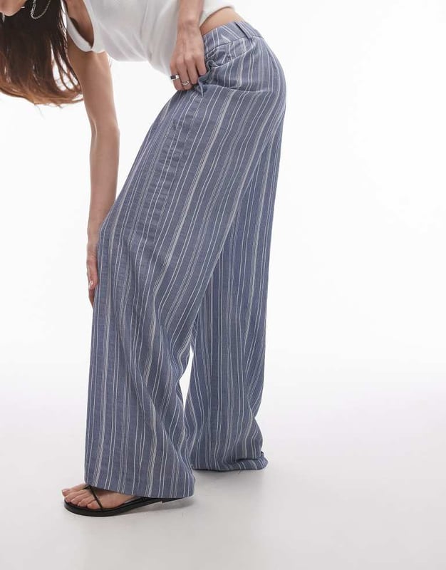 Trousers & Leggings by Topshop This is Topshop Low rise Belt loops Functional pockets Wide legSold By: Asos