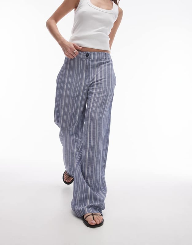 Trousers & Leggings by Topshop This is Topshop Low rise Belt loops Functional pockets Wide legSold By: Asos
