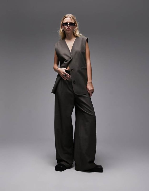 Joggers by Topshop Welcome to the next phase of Topshop Waistcoat sold separately High rise Belt loops Functional pockets Wide legSold By: Asos