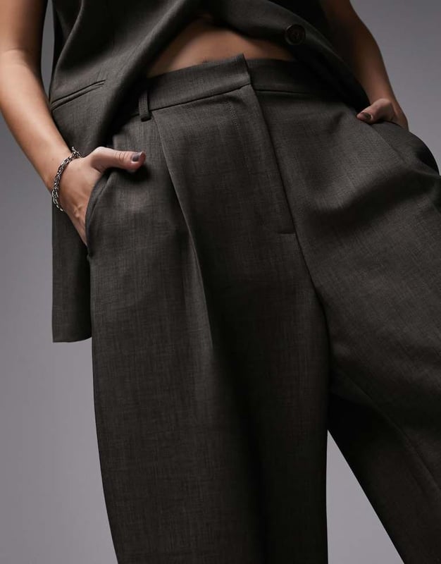 Joggers by Topshop Welcome to the next phase of Topshop Waistcoat sold separately High rise Belt loops Functional pockets Wide legSold By: Asos