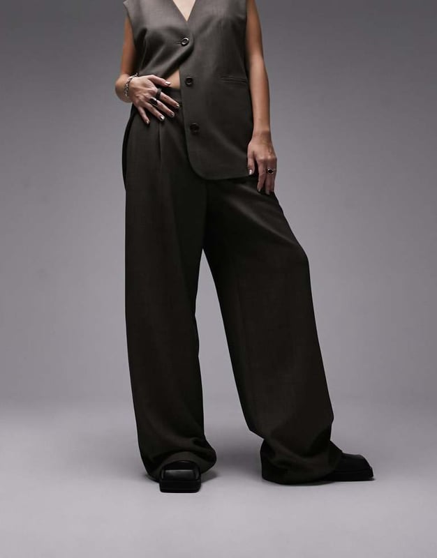 Joggers by Topshop Welcome to the next phase of Topshop Waistcoat sold separately High rise Belt loops Functional pockets Wide legSold By: Asos