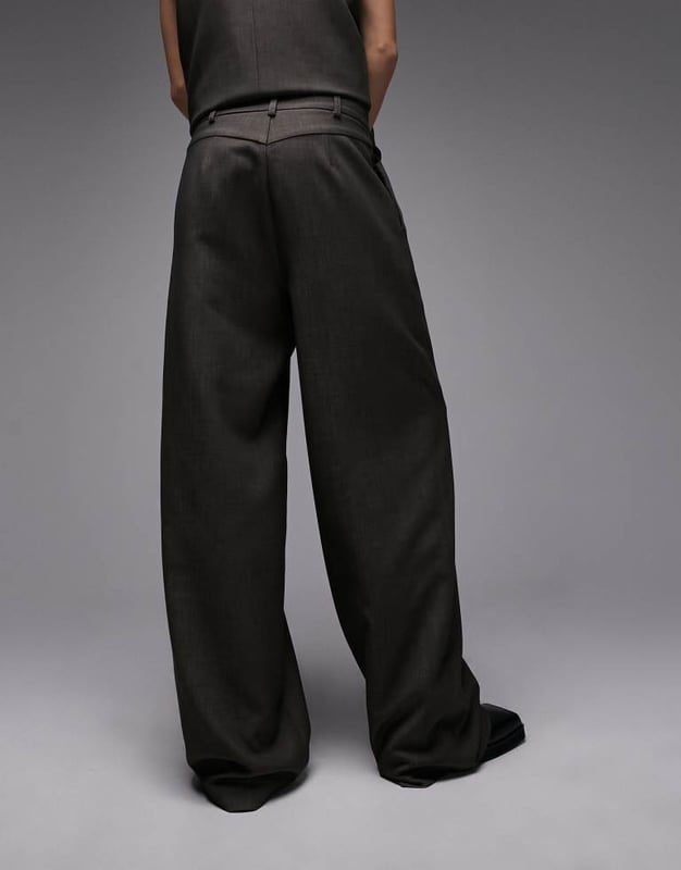 Joggers by Topshop Welcome to the next phase of Topshop Waistcoat sold separately High rise Belt loops Functional pockets Wide legSold By: Asos