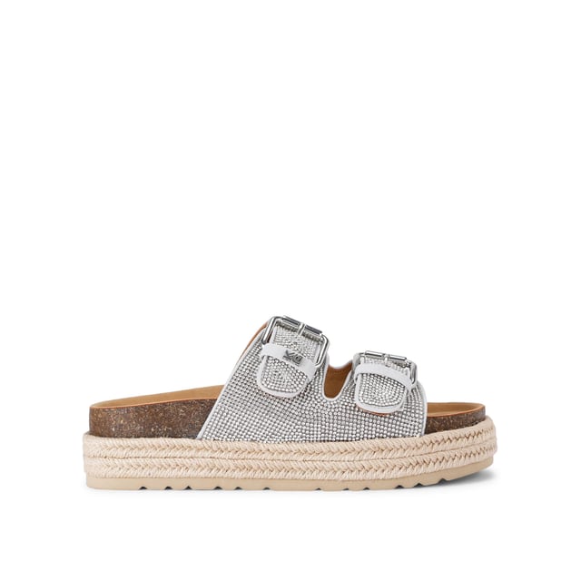 This KG Kurt Geiger Raquel Gem is a slip-on sandal with silver crystal embellishment across both of the straps. The straps are fastened with silver buckles and the sole is in a rope style.