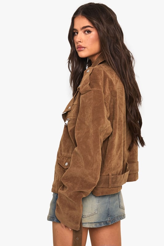 Oversized biker jacket in faux suede for a bold, edgy look
        Asymmetrical zip front closure for a modern twist
        Notched lapels and epaulettes for classic biker style
        Belted hem for adjustable fit and added flair
        Multiple pockets for both style and functionality
    
    Make a statement with this oversized biker jacket that combines timeless style with contemporary flair. The faux suede fabric offers a luxurious look and feel, perfect for those seeking a cruelty-free alternative. Its relaxed fit allows for easy layering, making it ideal for transitional weather. Style it with a simple white tee and denim shorts for a casual daytime look, or throw it over a floral dress for an edgy contrast at informal gatherings. For cooler evenings, pair with skinny jeans and ankle boots to create a sleek silhouette. The versatile nature of this jacket makes it a go-to piece for various casual occasions, from coffee dates to family barbecues. Its ability to effortlessly elevate any outfit ensures you'll stand out whilst remaining comfortably on-trend.
